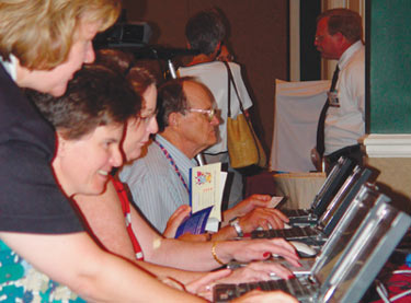 Attendees test the online economic tools at the NCVEI meeting.