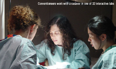 Conventioneers work with a cadaver in one of 32 interactive labs