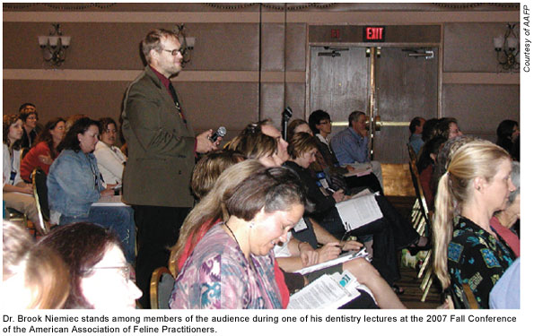 Dr. Brook Niemiec stands among members of the audience during one of his dentistry lectures at the 2007 Fall Conference of the American Association of Feline Practitioners.