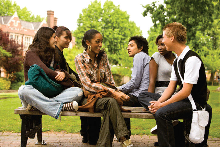 Diverse group of students sitting in a courtyard