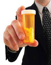 Man holding a bottle of pills