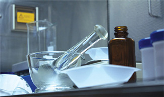 Mortar and pestle, and drug containers in a compounding facility