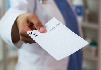 Doctor handing out a written prescription