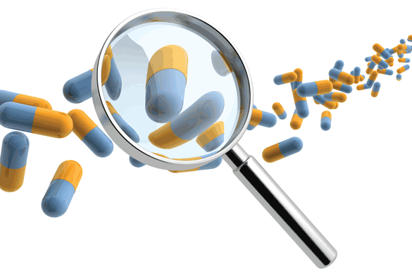 Supplement capsules under a magnifying glass