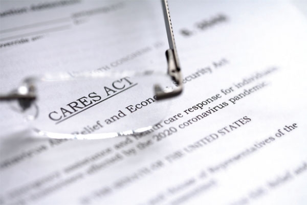 Part of CARES Act document seen through an eyeglass lens